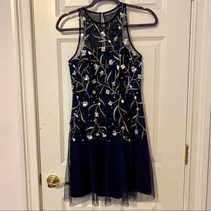 Navy cocktail dress with floral stitching / bead